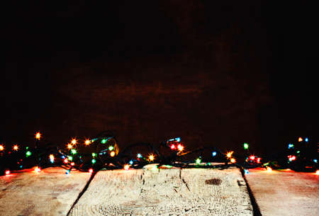 Garland on vintage wooden background, Christmas or New Year's background, selective focusの写真素材