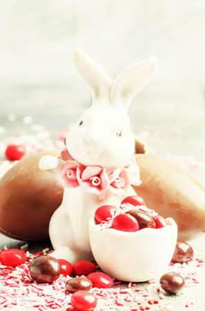 Easter composition with a rabbit and eggs, gray background, selective focusの写真素材