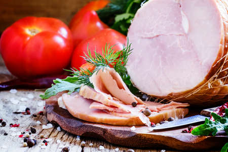 Large piece of boiled-smoked pork ham, selective focus
