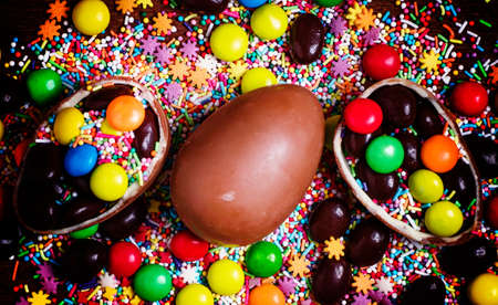 Easter background with eggs and sweets, top view