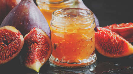 Delicious jam sweet figs with honey, selective focus and toned image