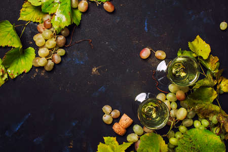 Champagne In Glasses, Grapes With Vine, Black Background, Top Viewの写真素材
