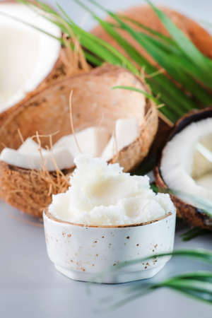 MCT Coconut butter or coconut oil. Organic healthy food, beauty and SPA concept. Gray background. Copy spaceの写真素材
