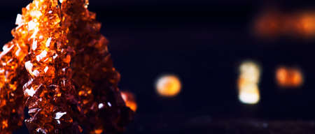 Candy cane sugar, brown sugar sticks on a dark table, selective focusの写真素材
