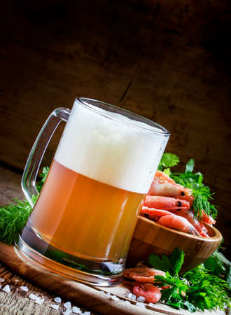 Beer and shrimp, vintage wooden background, selective focusの写真素材