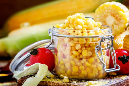 Preserved corn in a glass jar, selective focusの写真素材