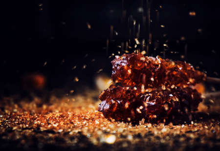 Sweet sugar sticks, dark background, selective focus
