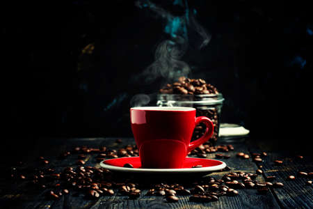 Black coffee in a red cup, black background, selective focusの写真素材