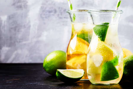 Citrus Ice tea in bottles, selective focus