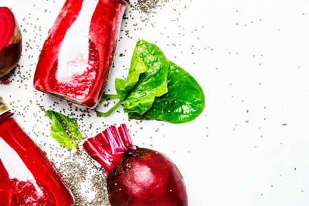 Beetroot smoothies with chia seeds, glass bottles, gray background, top viewの写真素材