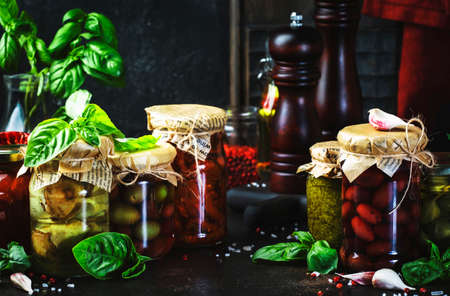 Canned food concept. Fermented, pickled, marinated preserved vegetarian italian snacks and sauces....