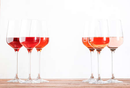Rose wine glasses set on wine tasting. Tasting different varieties, colors and shades of pink wine...