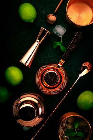 Copper bar tools and bartender accessories for making cocktail. Shaker, jigger, strainer, spoon....