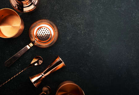 Copper bar tools and bartender accessories for making cocktail. Shaker, jigger, strainer, spoon....