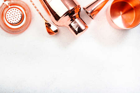 Set of copper bar tools for making cocktails, white background, top view bannerの写真素材