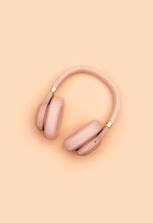 Pink Wireless Headphones on pale pink pastel background. Trendy minimal style. Music concept. Flat lay banner with copy space, top viewの写真素材