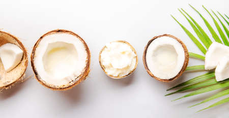 MCT Coconut butter or hard oil. Organic healthy food, beauty and SPA product. Gray background