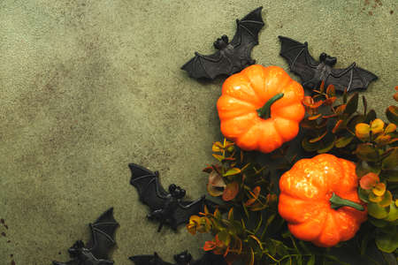 Happy Halloween swamp green background with pumpkins, bats with copy spaceの写真素材