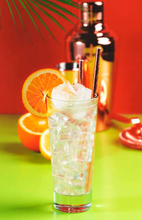 Tom Collins popular alcoholic cocktail with dry gin, syrup, lemon juice, soda, orange and ice....