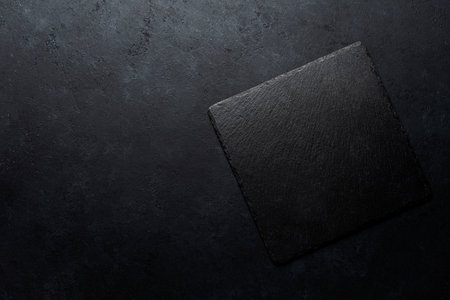 Black painted concrete texture or background and slate board with shadow.and with place for text. Template for designの写真素材