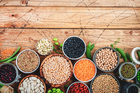 Legumes, beans and sprouts. Dried, raw and fresh, top view. Lentils, mung beans, chickpeas,...