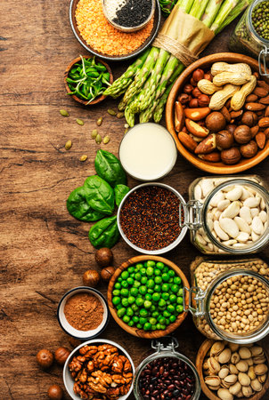 Vegan protein. Full set of plant based vegetarian food sources. Healthy eating, diet ingredients: legumes, beans, lentils, nuts, soy and almond milk, tofu, quinoa, chia, vegetables, spinach, seeds and sprouts. top viewの写真素材