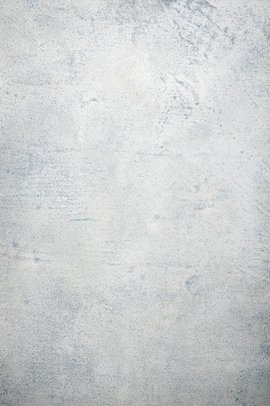Gray painted concrete texture or background with grain elements. Image with place for text. Template...