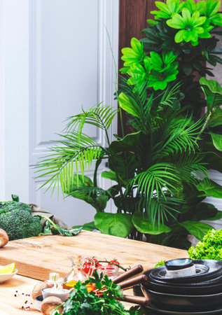 Healthy vegan food, eating, cooking, blogging background. Empty oak cutting board with mushrooms, tomatoes, lettuce, vegetables on cozy kitchen with wooden table, kitchenware and utensilsの写真素材