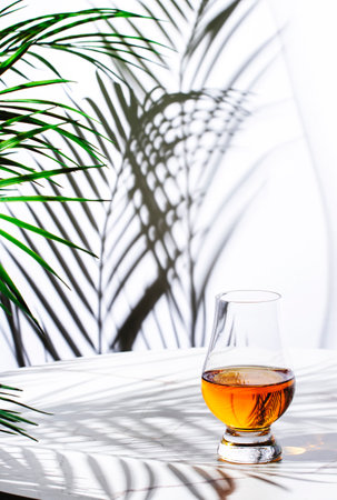 Single malt Scotch whiskey in glencairn glass n white backgroundの写真素材