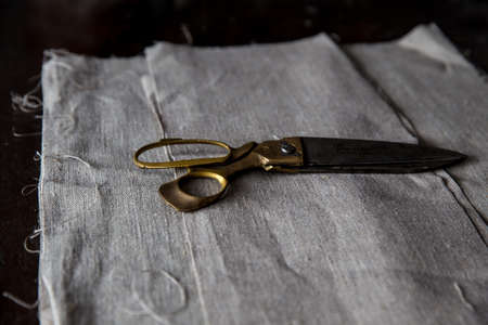 Linen fabric and brass scissors