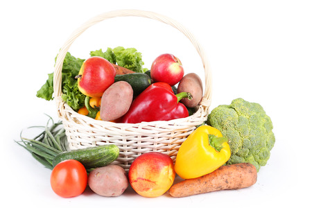 Vegetable in basket isolated on whiteの写真素材