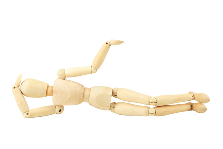 Wooden figure resting isolated on whiteの写真素材