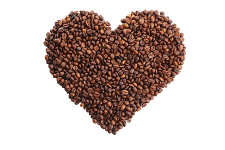 Heart from coffee beans isolated on whiteの写真素材