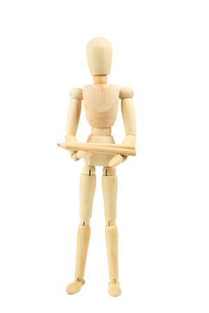Wooden figure with pencil isolated on whiteの写真素材
