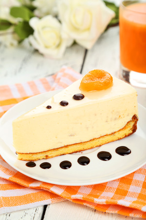 Cheesecake on the plate on white wooden backgroundの写真素材