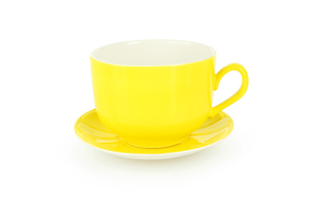 Empty yellow cup isolated on whiteの写真素材