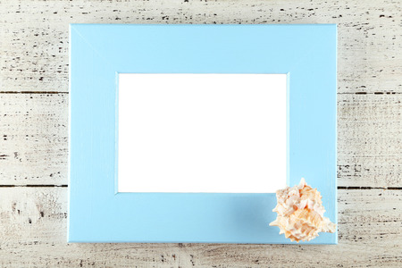 Wood frame on white wooden backgroundの写真素材