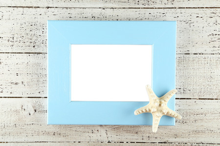Wood frame on white wooden backgroundの写真素材