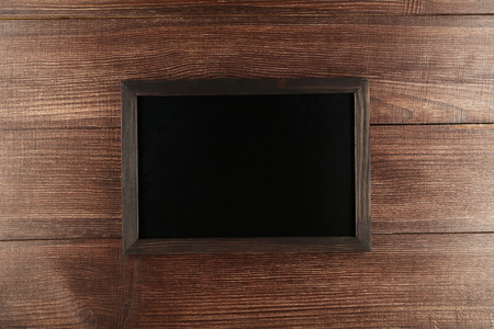 Wood frame on brown wooden backgroundの写真素材