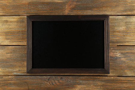 Wood frame on brown wooden backgroundの写真素材
