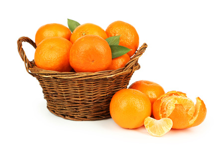 Mandarin in basket isolated on whiteの写真素材