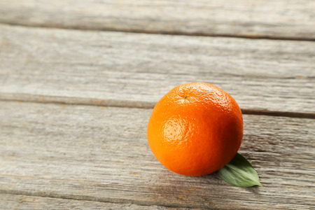 Mandarin on green wooden backgroundの写真素材