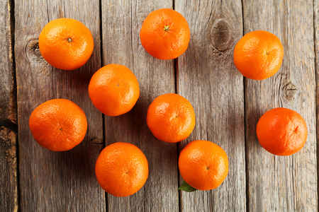 Mandarin on green wooden backgroundの写真素材