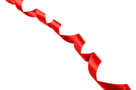 Red ribbon on white backgroundの写真素材