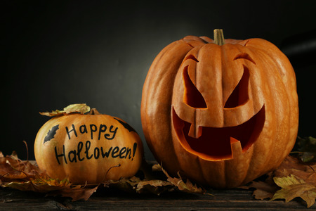 Halloween pumpkin on brown wooden backgroundの写真素材