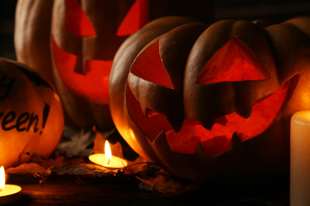 Halloween pumpkin on brown wooden backgroundの写真素材