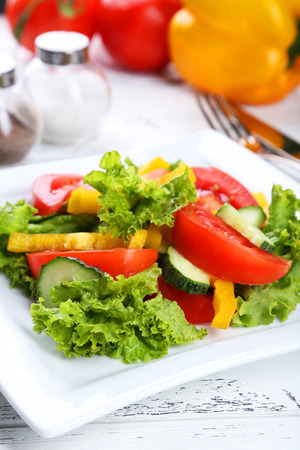 Fresh vegetable salad on white wooden backgroundの写真素材