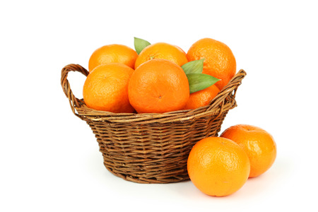 Mandarin in basket isolated on whiteの写真素材