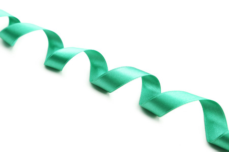 Green ribbon on white backgroundの写真素材