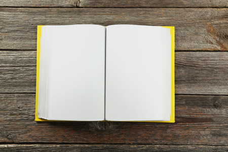 Open book on grey wooden backgroundの写真素材